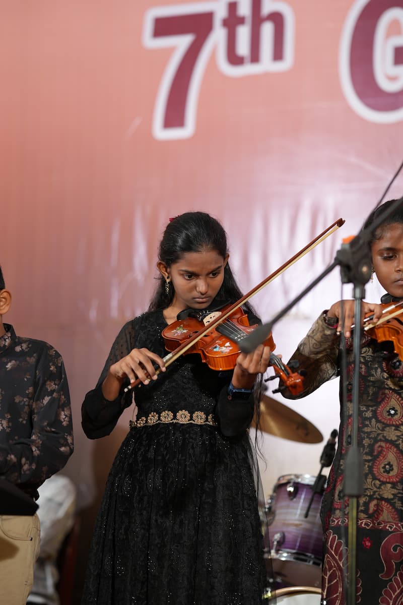 Violin student performance on stage